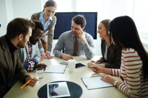 business team around a table discussing