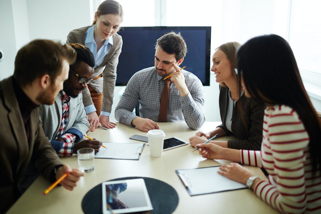 business team around a table discussing
