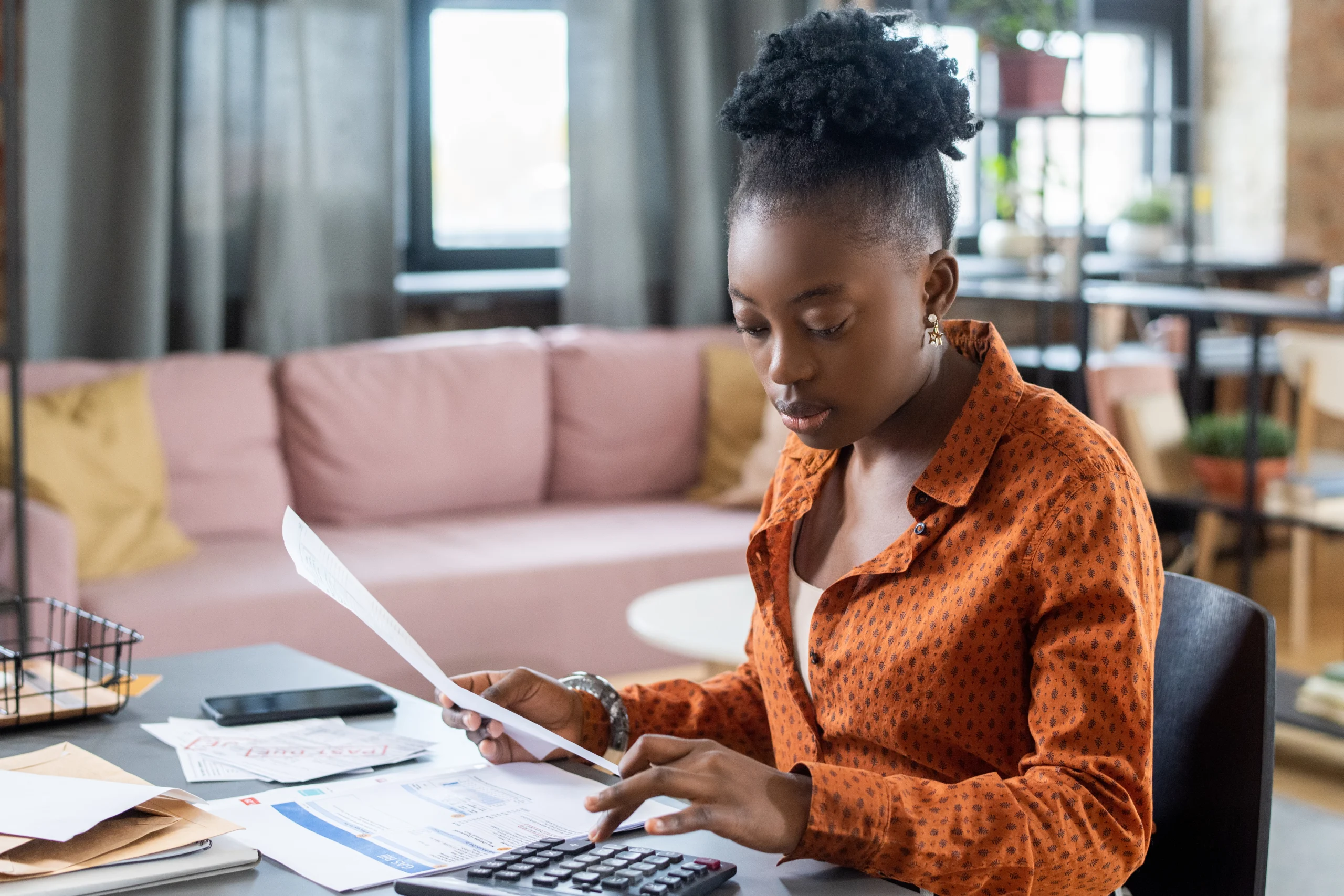 blackwoman-calculating-tax-bill